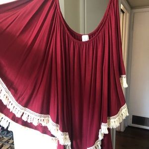 Maroon shirt with fringe.